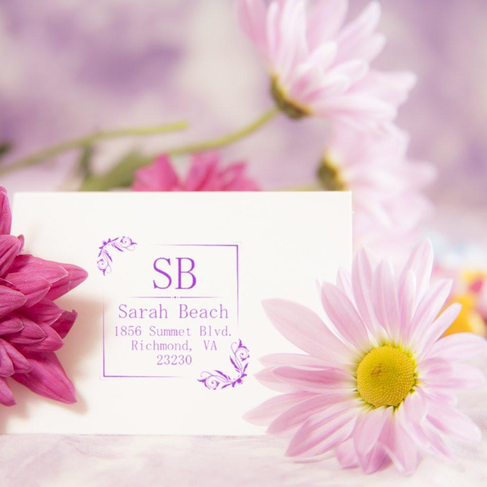 Custom floral return address rubber stamp with monogram, ideal for wedding invitations and personalized stationery.