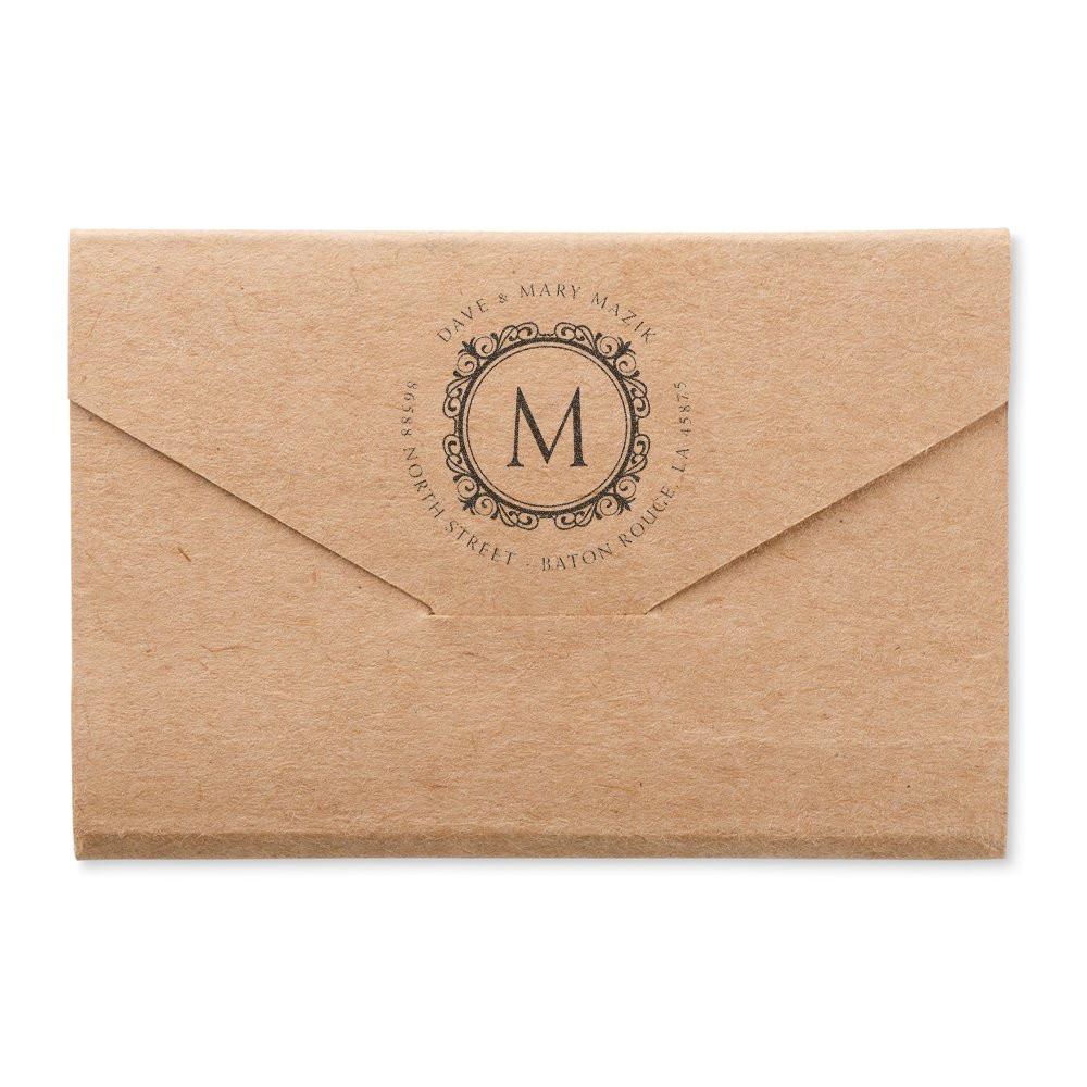 Custom monogram rubber stamp on kraft envelope for wedding invitations and return address branding