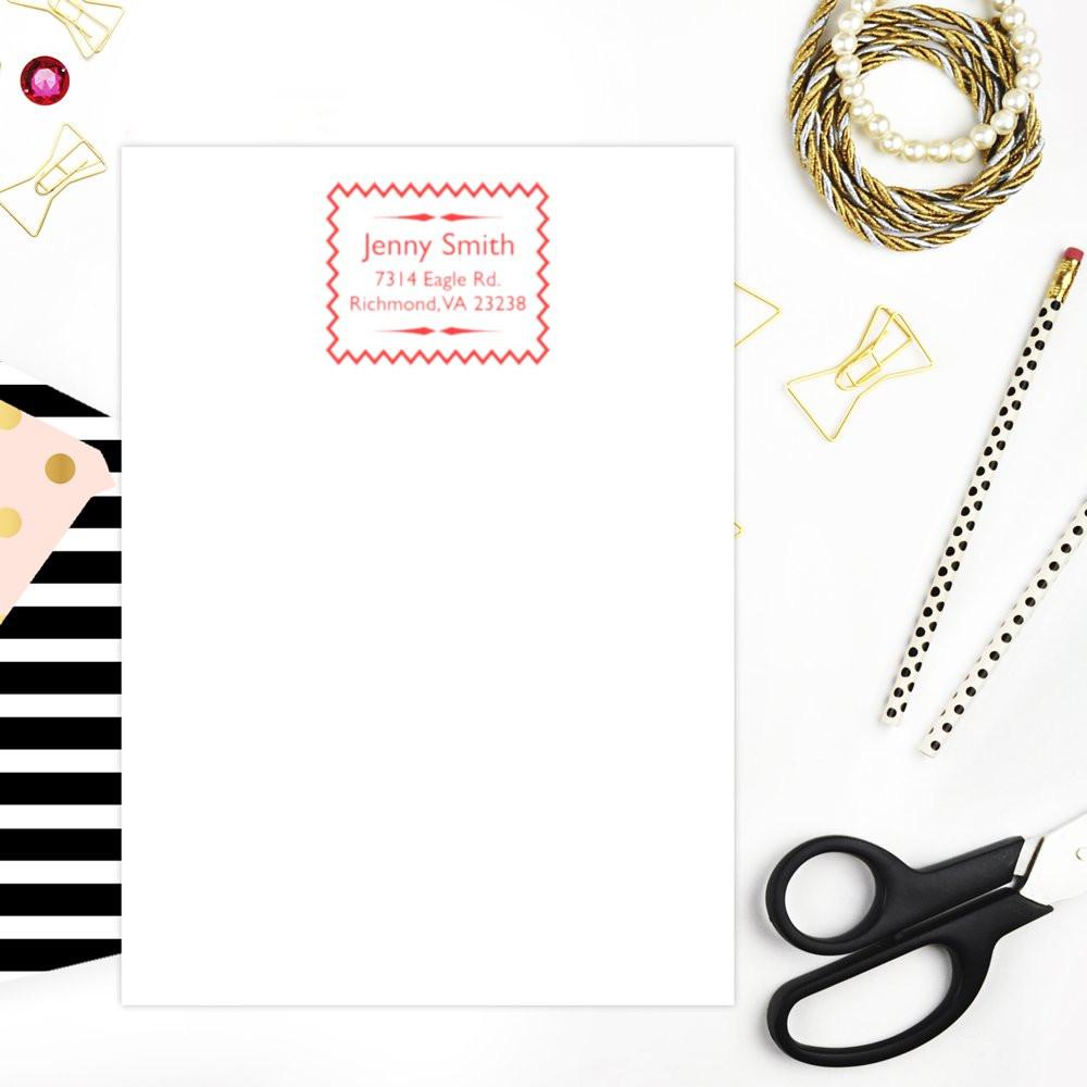 Personalized return address rubber stamp mockup on stationery with custom name and address for mailing.