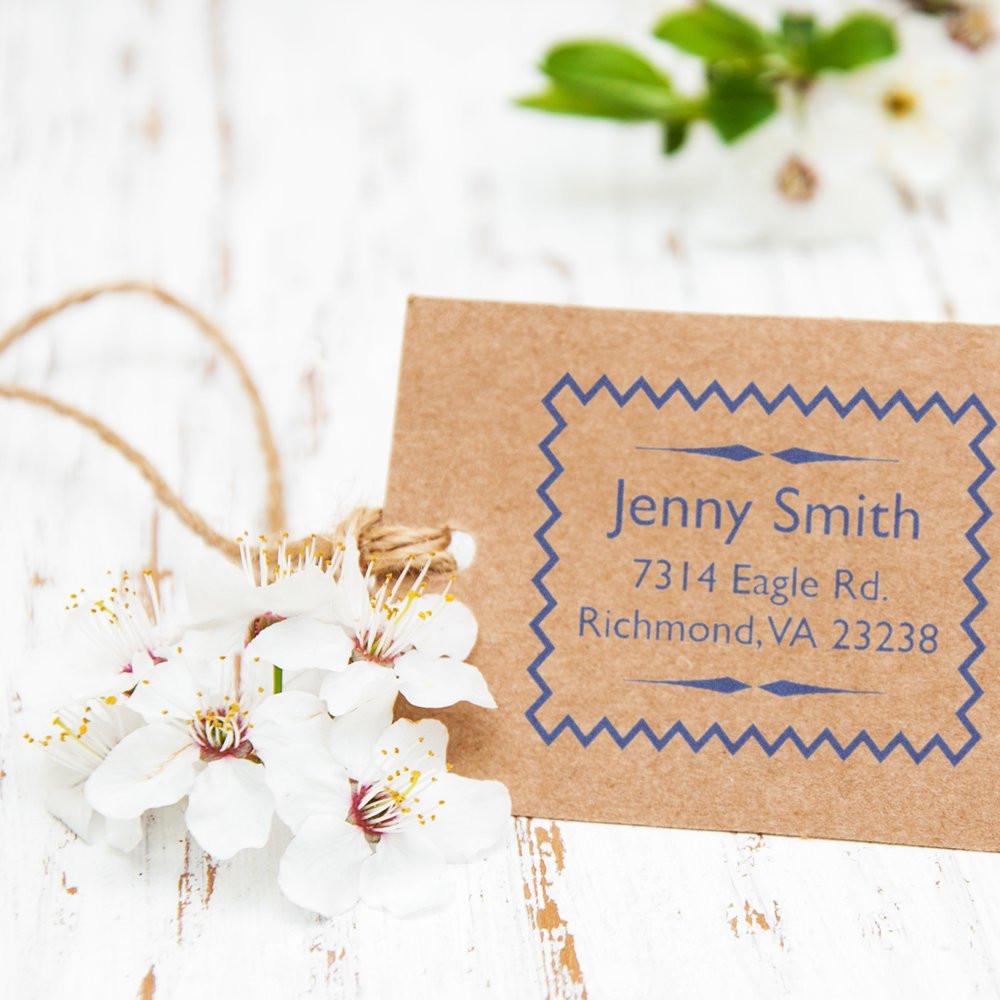 Personalized return address rubber stamp on kraft tag, perfect for envelopes, wedding invitations, and handmade packaging.