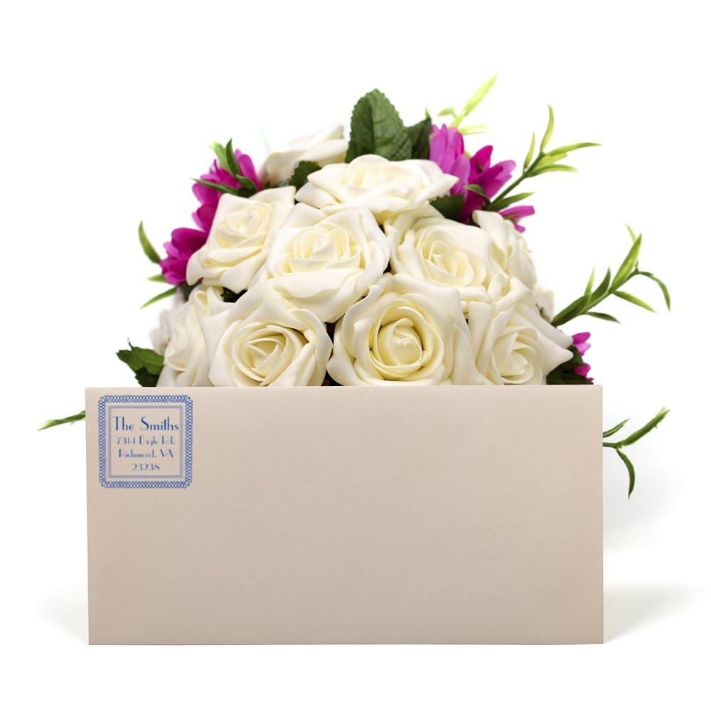 Custom return address rubber stamp on wedding envelope with floral bouquet, ideal for personalized stationery and mailings.