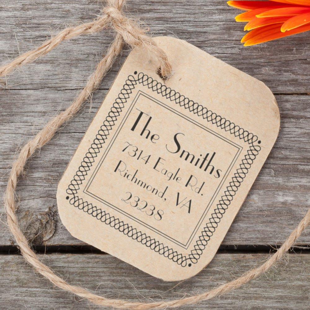 Custom return address rubber stamp on kraft tag with vintage border, ideal for personalized wedding or business mailings.