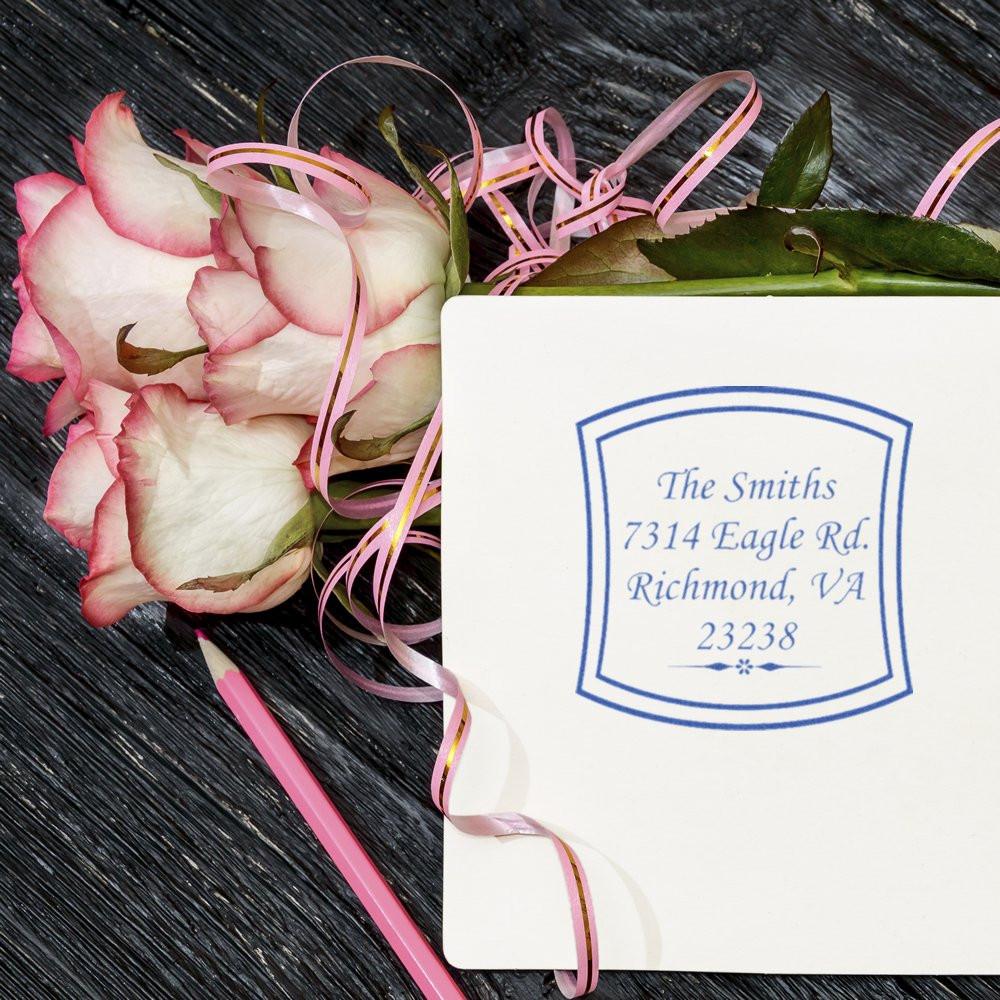 Custom address rubber stamp with The Smiths' Richmond, VA address beside roses for elegant wedding stationery.