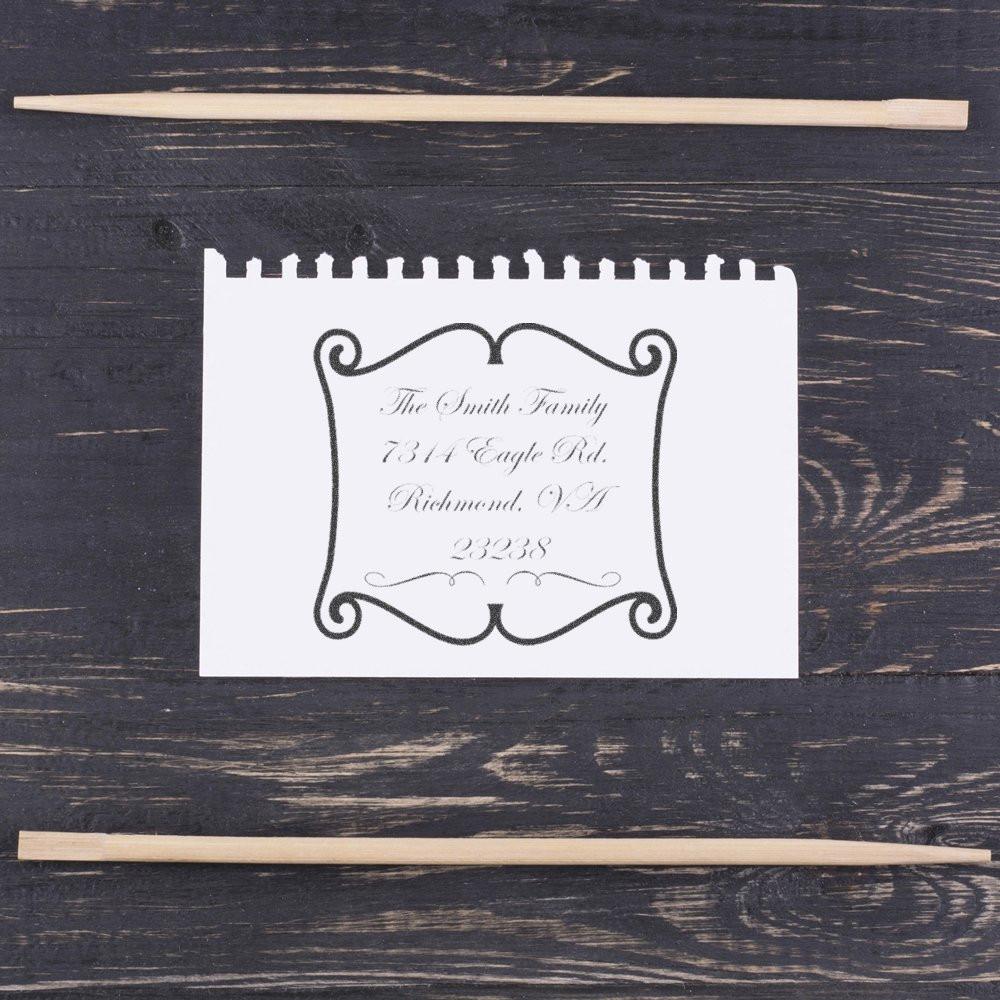 Custom rubber return address stamp with ornate frame, ideal for personalized family mailing and wedding stationery.