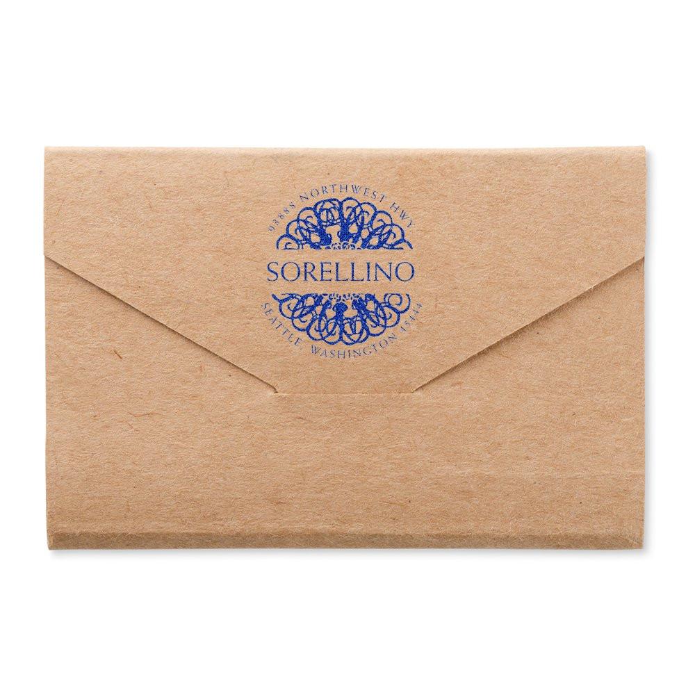 Custom blue rubber stamp on kraft envelope with Sorellino logo, ideal for branded return address and wedding stationery.