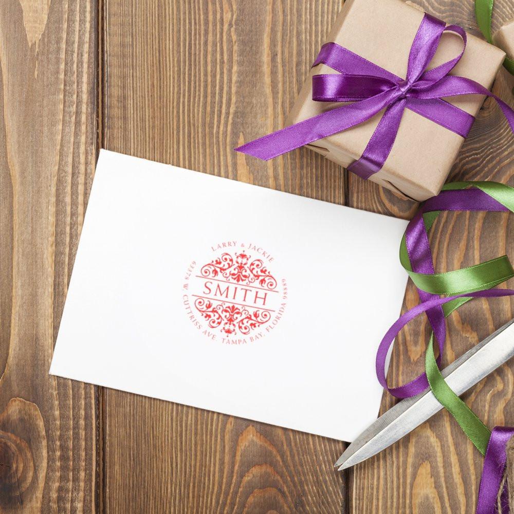 Custom monogram rubber stamp on wedding envelope, ideal for personalized stationery, invitations and gift packaging.