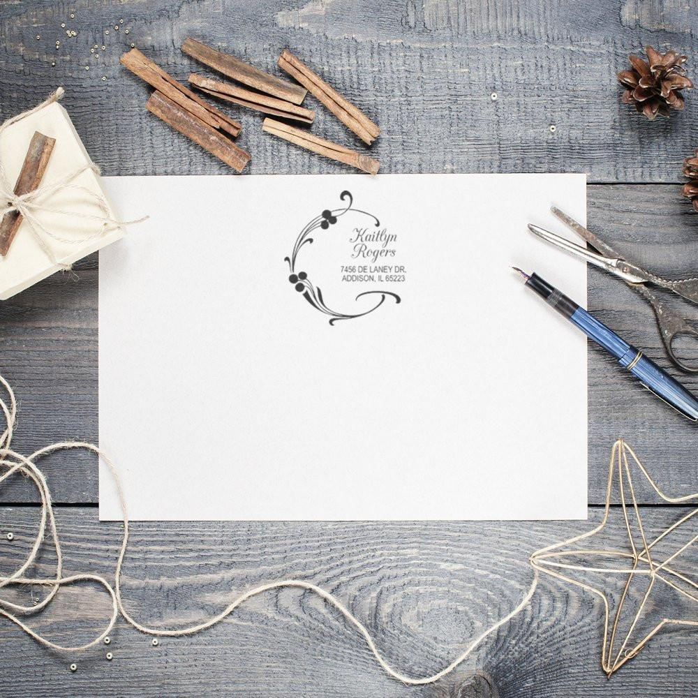 Personalized address rubber stamp with floral monogram on stationery, ideal for wedding invitations, envelopes, and custom mailings.