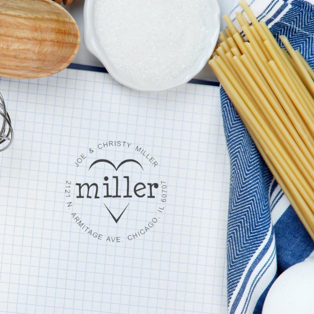 Custom rubber stamp imprint with Miller family name and Chicago return address for personalized wedding stationery.