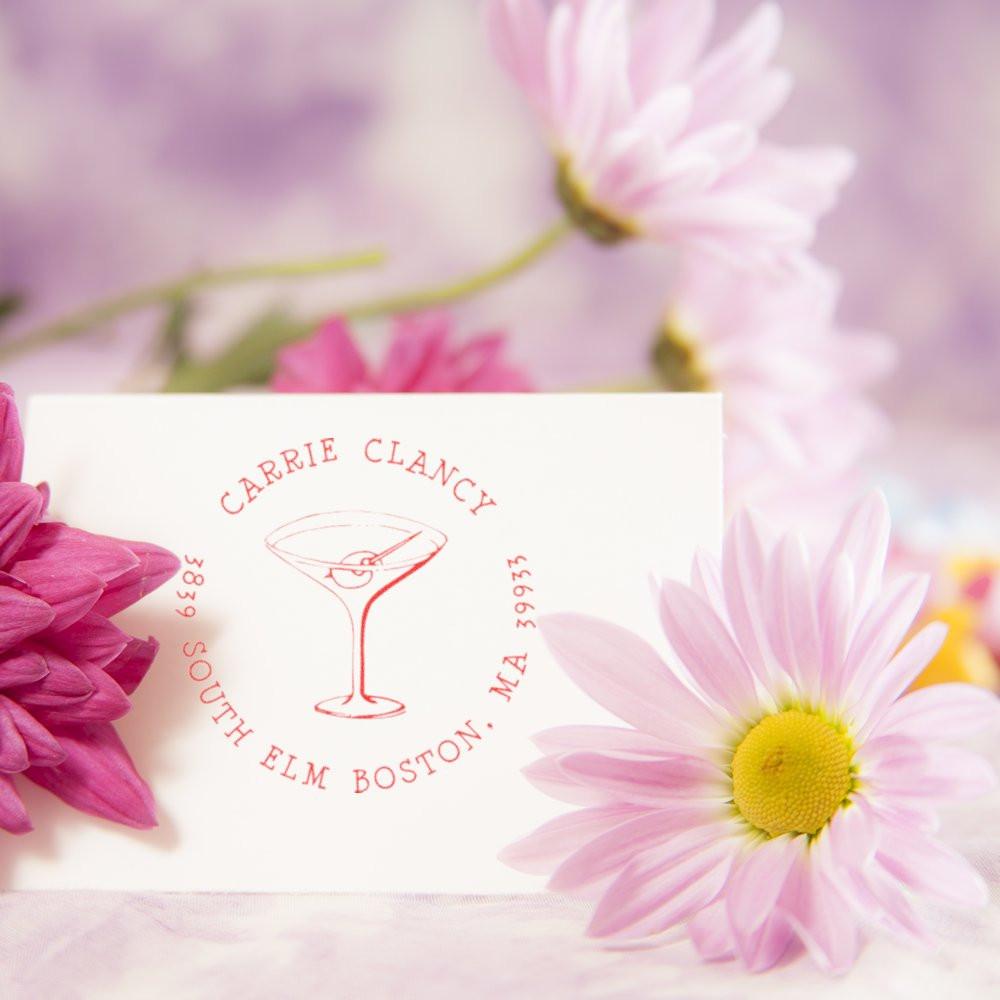 Custom return address rubber stamp with martini glass design for Carrie Clancy, South Elm Boston, MA.