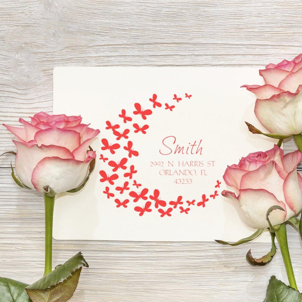 Custom butterfly floral rubber stamp with return address for wedding invitations, featuring Smith name and red circle design.