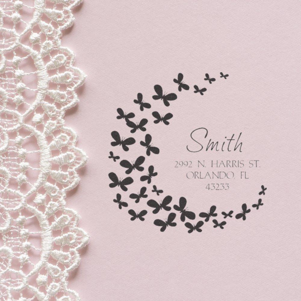 Personalized butterfly address rubber stamp with Smith return address on pink stationery, framed by lace trim.
