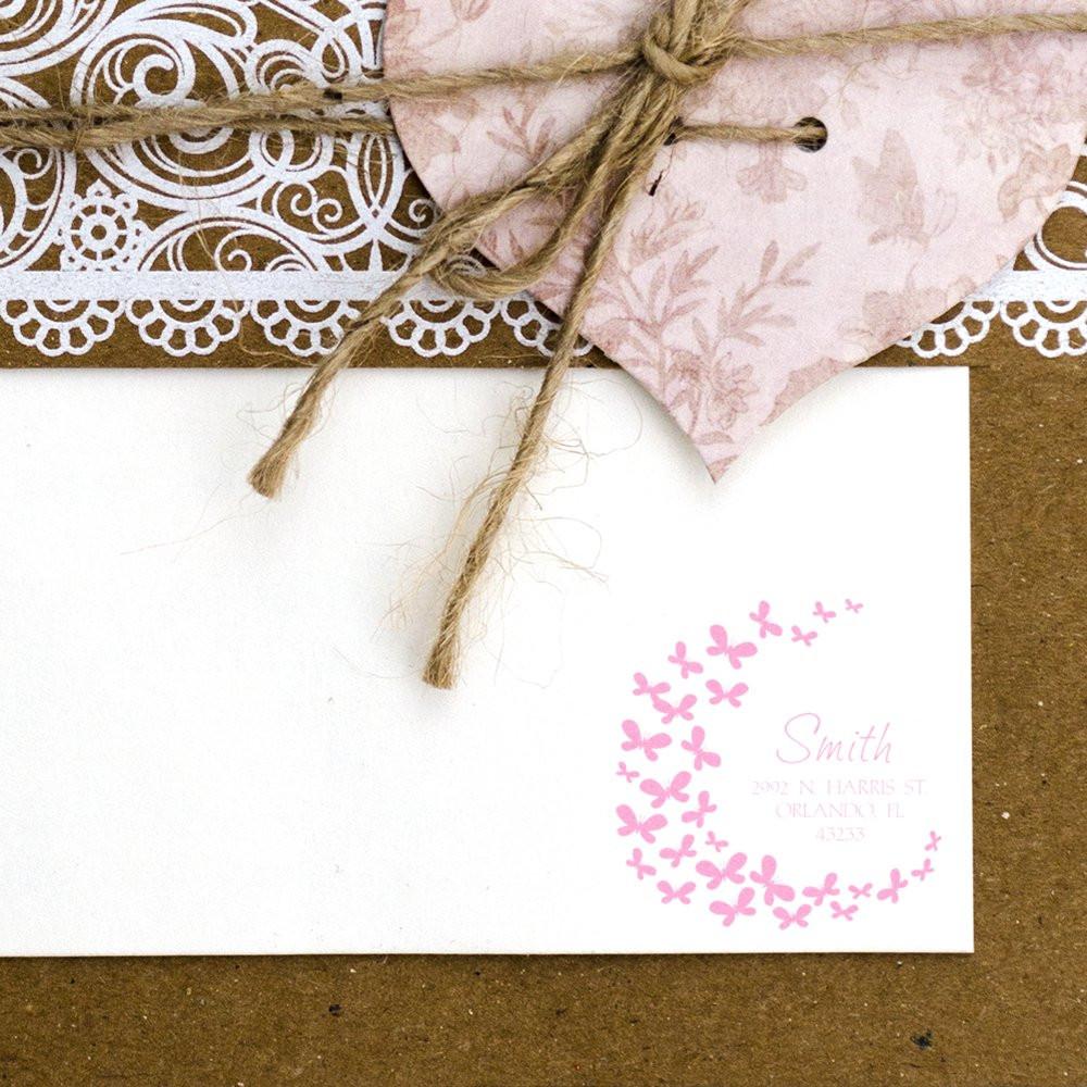 Pink butterfly wreath custom rubber stamp on a wedding invitation card with monogram and return address for DIY stationery.