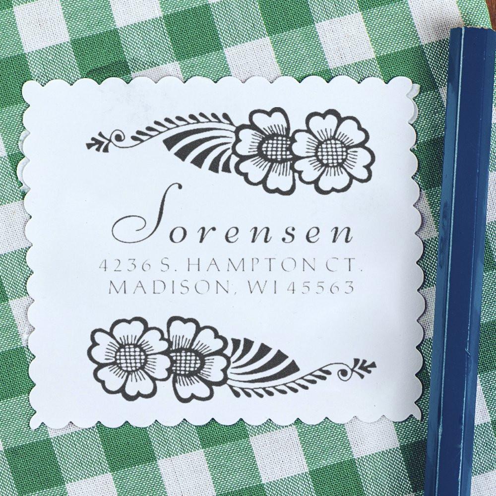 Custom floral address rubber stamp impression with name and Madison, WI return address for wedding invitations.