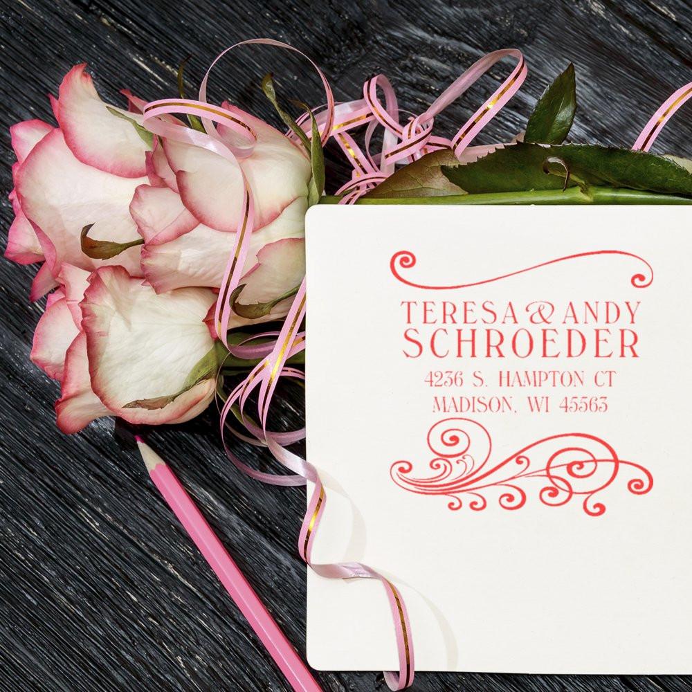 Custom floral address rubber stamp for wedding stationery, shown with roses and pink ribbon.