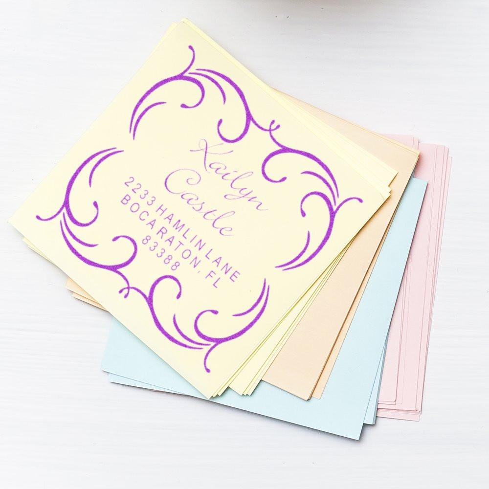 Personalized wedding rubber stamp for invitations, featuring a purple ornate monogram and return address.