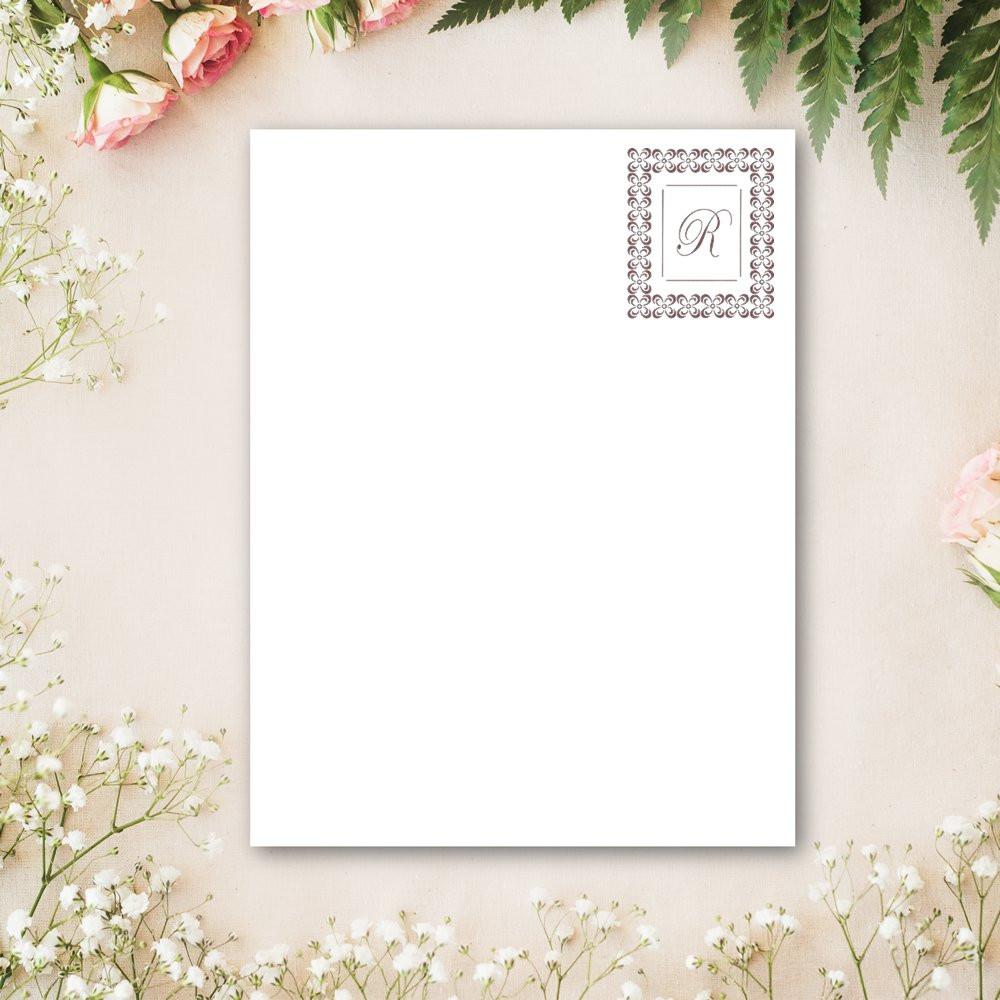 Custom monogram rubber stamp on blank floral stationery mockup for wedding invitations and personalized paper goods