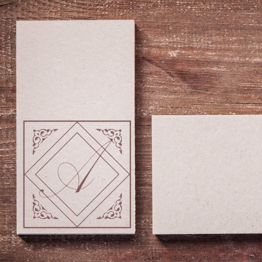 Custom rubber stamp impression on kraft paper stationery, ideal for branding handmade packaging and paper goods.