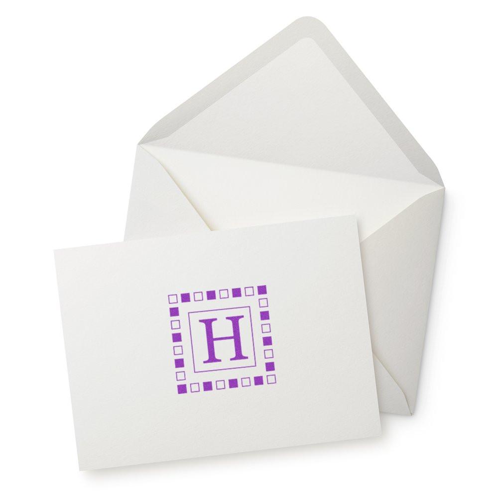 Personalized monogram rubber stamp with purple letter H on white stationery card and envelope