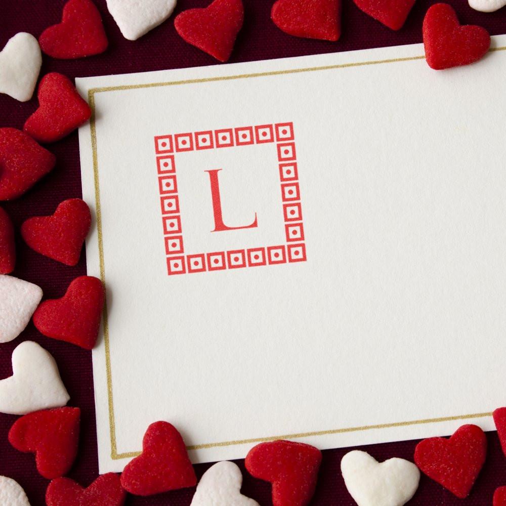 Valentines Day card with custom rubber stamp monogram letter L, framed by hearts for personalized stationery.