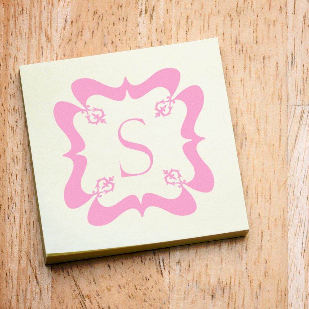 Custom monogram rubber stamp with ornate pink letter S design for personalized stationery, invitations, and craft projects.