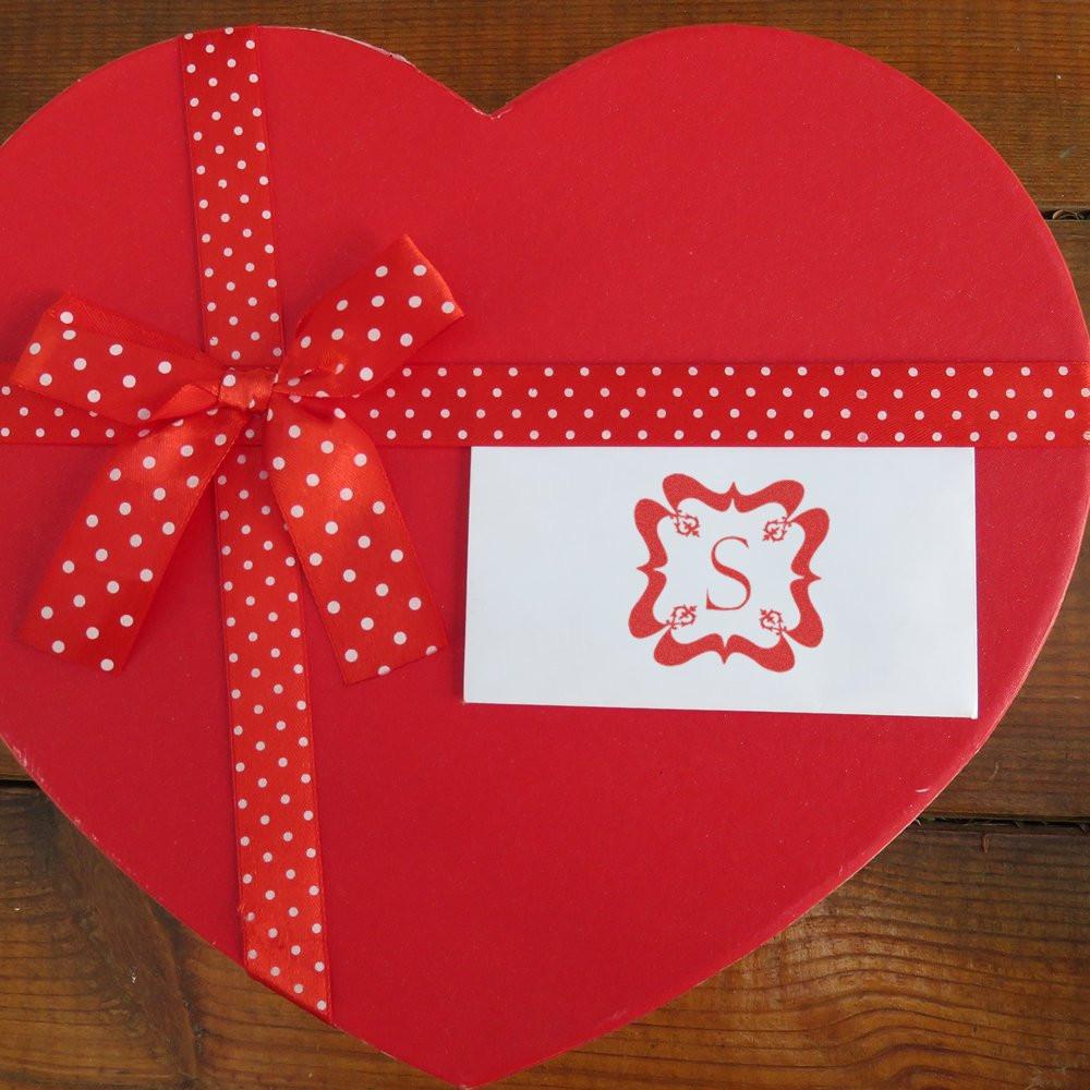 Heart-shaped Valentine gift box with polka dot ribbon and custom monogram rubber stamp card.