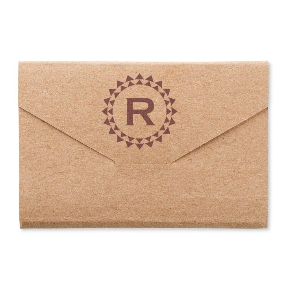 Custom rubber stamp monogram R on kraft envelope for branded wedding stationery, packaging, and business mailings