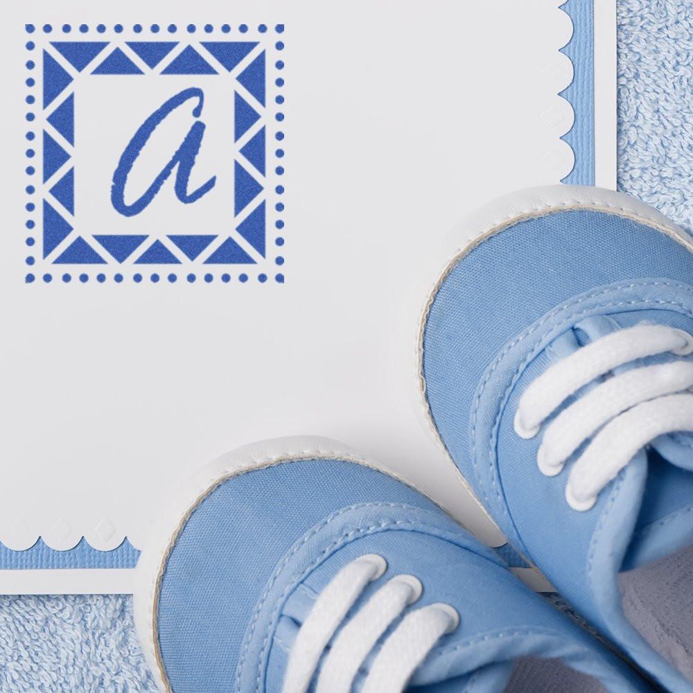 Personalized blue rubber stamp with lowercase a monogram on a baby shower card with baby shoes