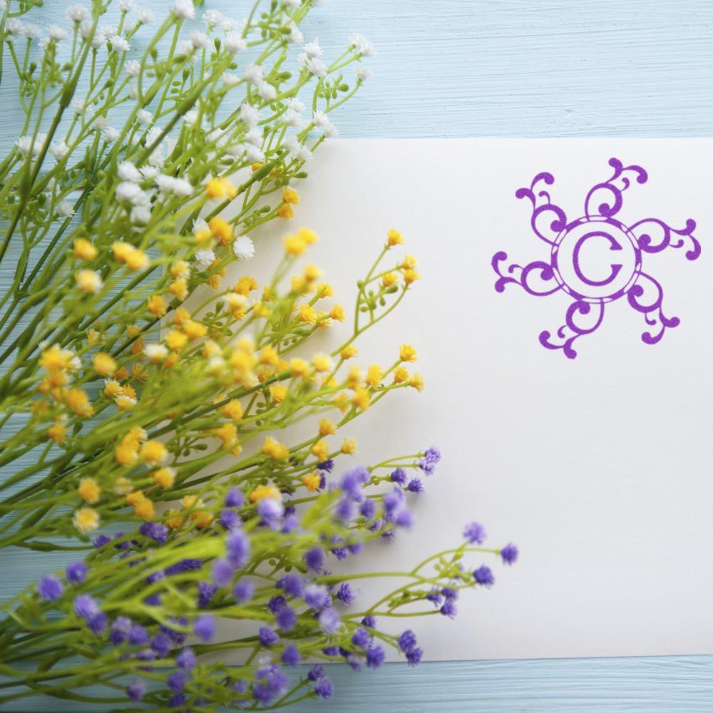 Spring wildflower bouquet with purple floral sun icon on white background for wellness and aromatherapy