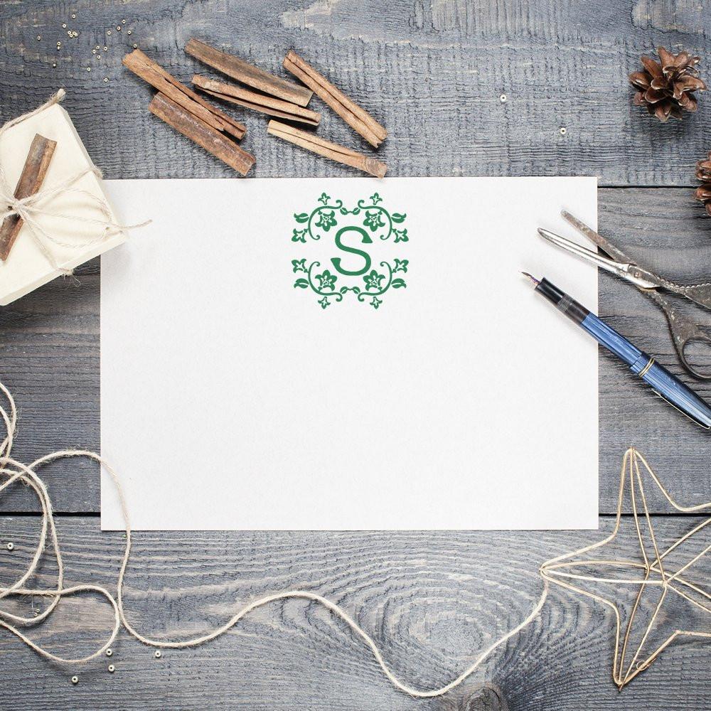 Custom floral monogram rubber stamp with letter S on stationery for wedding invitations and personalized crafts