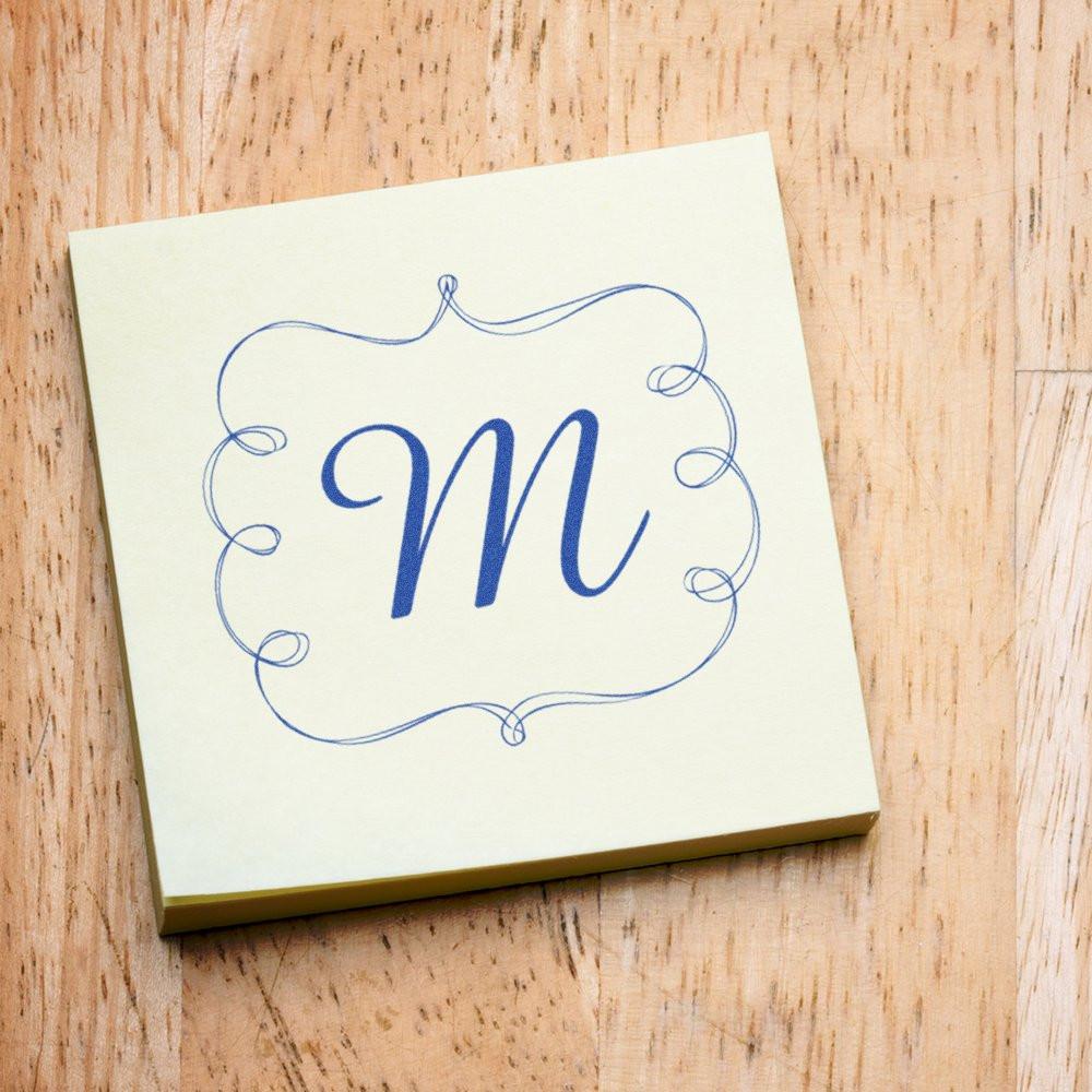 Custom monogram M rubber stamp design with ornate border for personalized wedding invitations and stationery.