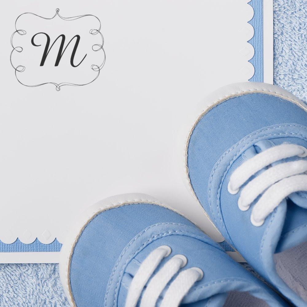 Custom monogram M rubber stamp for baby shower invitations, personalized stationery, and blue baby-themed crafts.