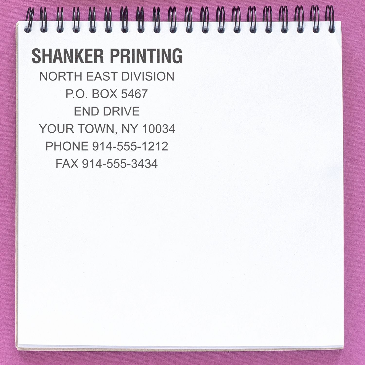 Shanker Printing North East Division contact info on a spiral notepad, PO Box 5467, End Drive, NY 10034, phone and fax.