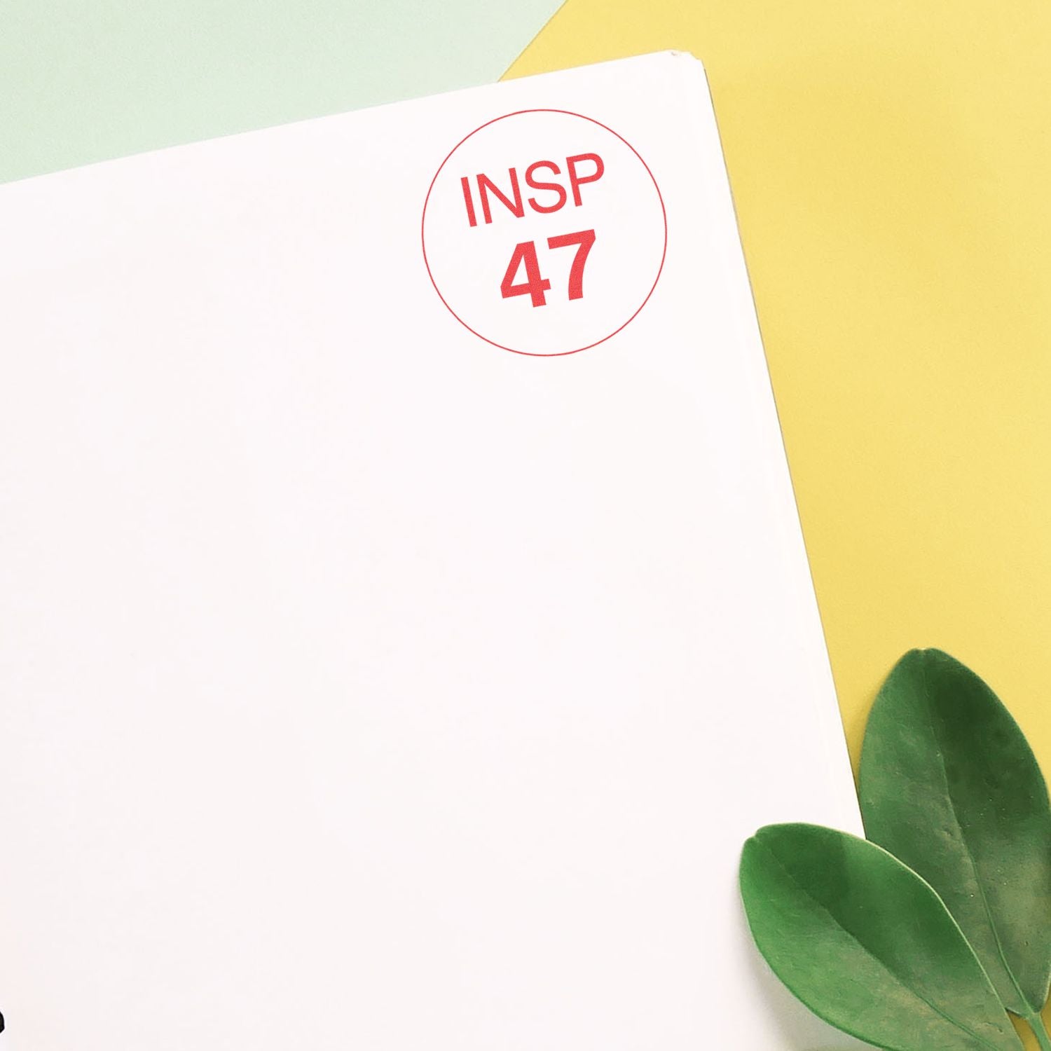 INSP 47 inspiration stamp on a white card with pastel background and green leavesbranding design for creative series