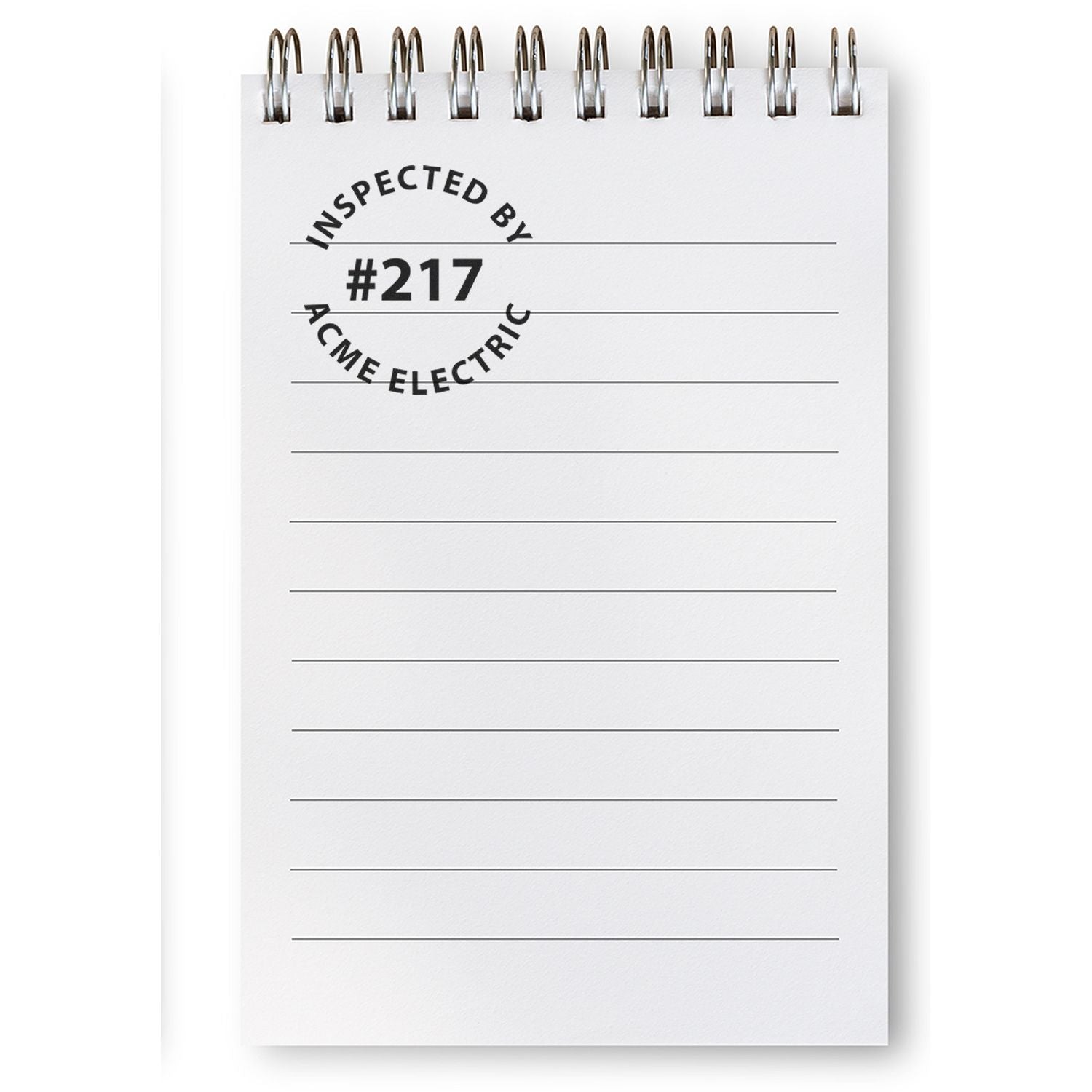 ACME Electric inspected by #217 notepad with lines and clip, showing office inspection label for compliance documentation paper