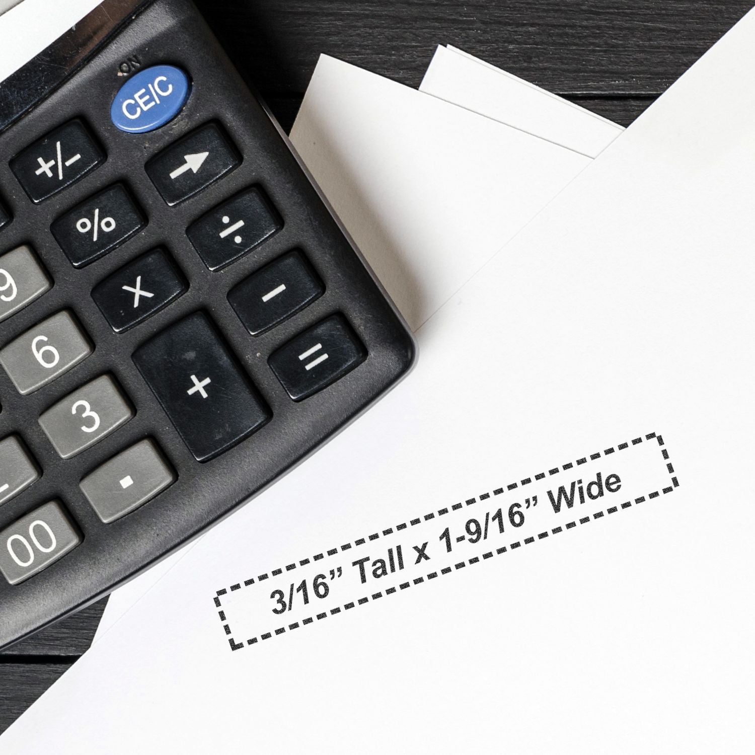 Calculator and paper template with dashed box highlighting 3/16-inch tail x 1-9/16-inch wide dimensions for accurate labeling