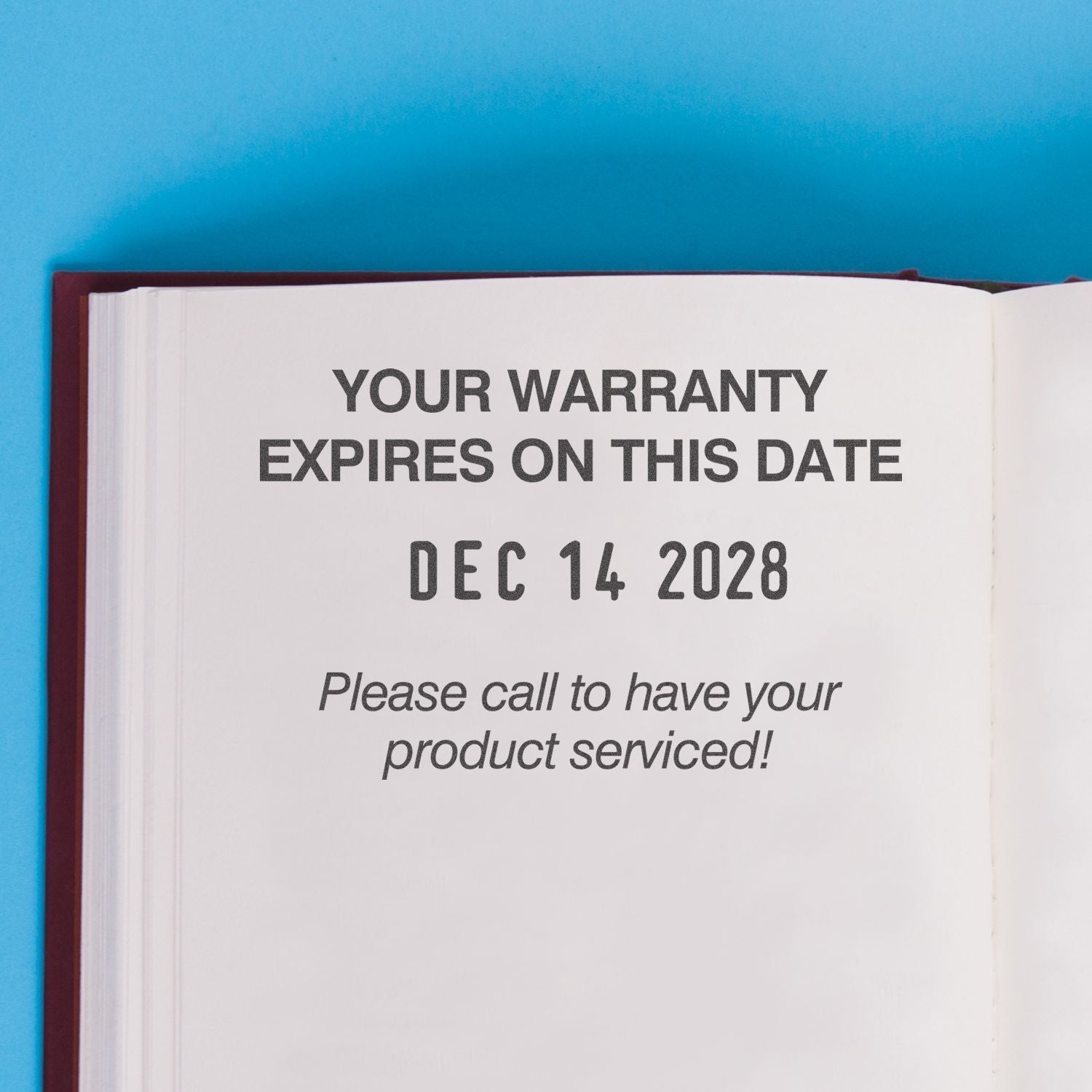 Open book page showing warranty expiration date, Dec 14, 2028, with product service reminder text.