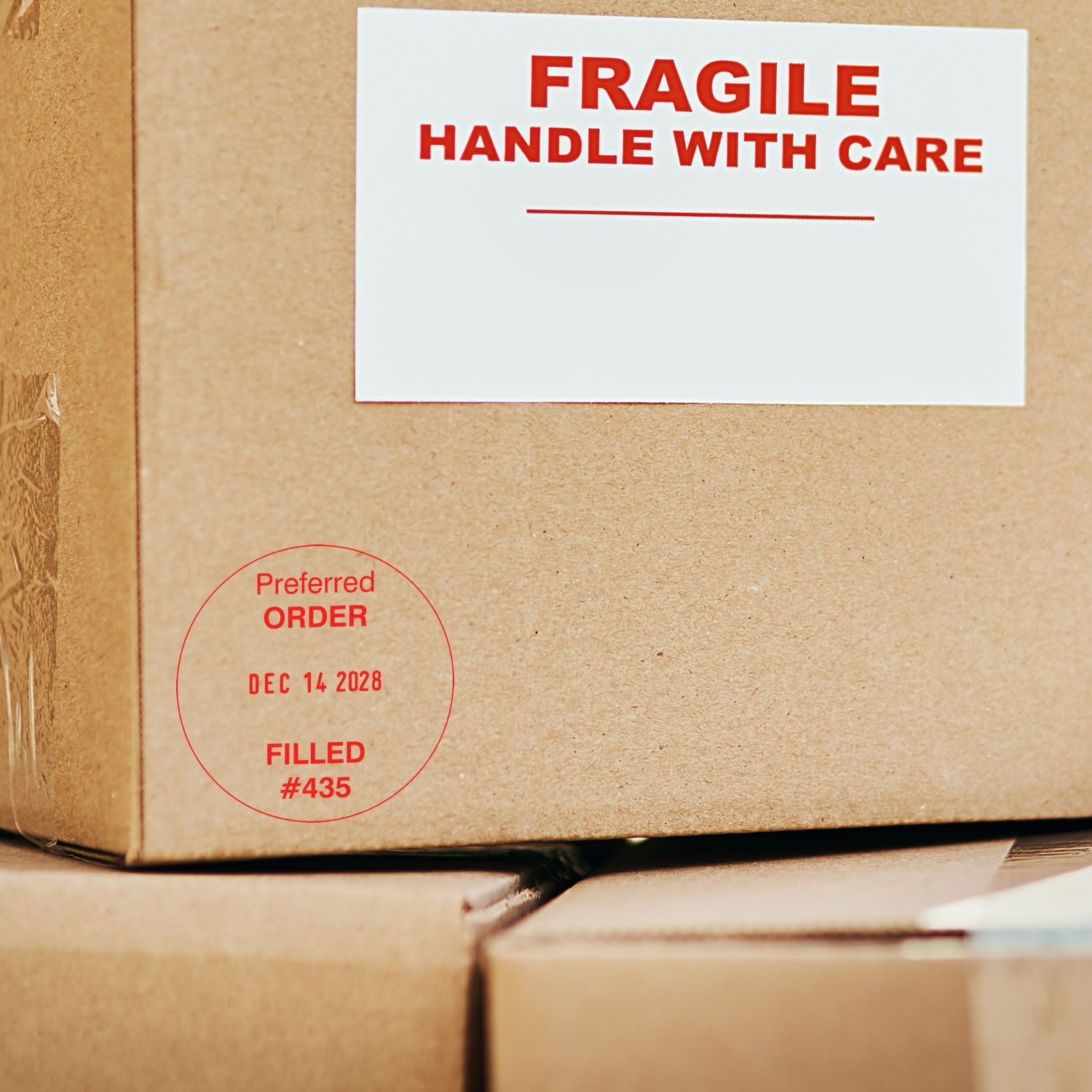 Fragile shipping box with handle with care label on stacked cardboard packages