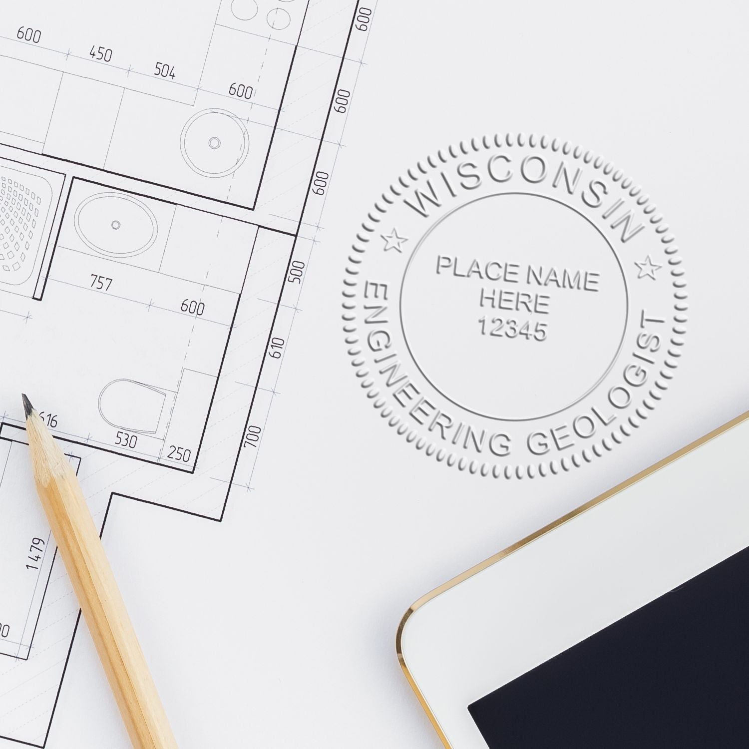 Architectural blueprint with pencil and tablet displaying Wisconsin Engineering Geologist logo stamp design.
