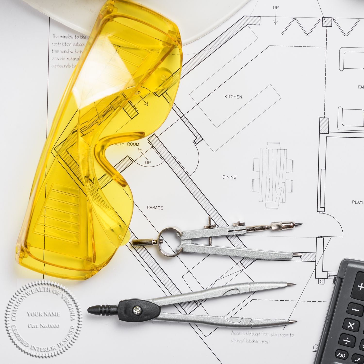 Architectural floor plan with drafting tools, calculator, and yellow safety glasses for home design and construction planning.