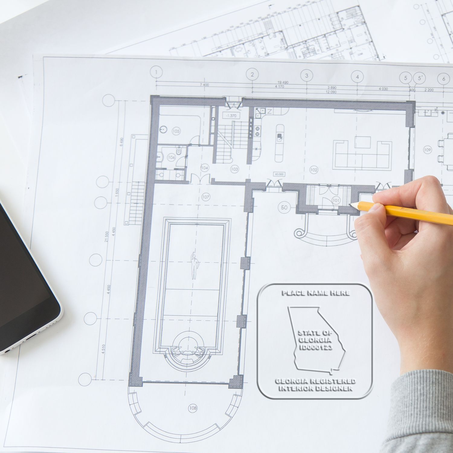 Architectural floor plan sketch with hand using pencil, interior design blueprint drafting, and home renovation planning.