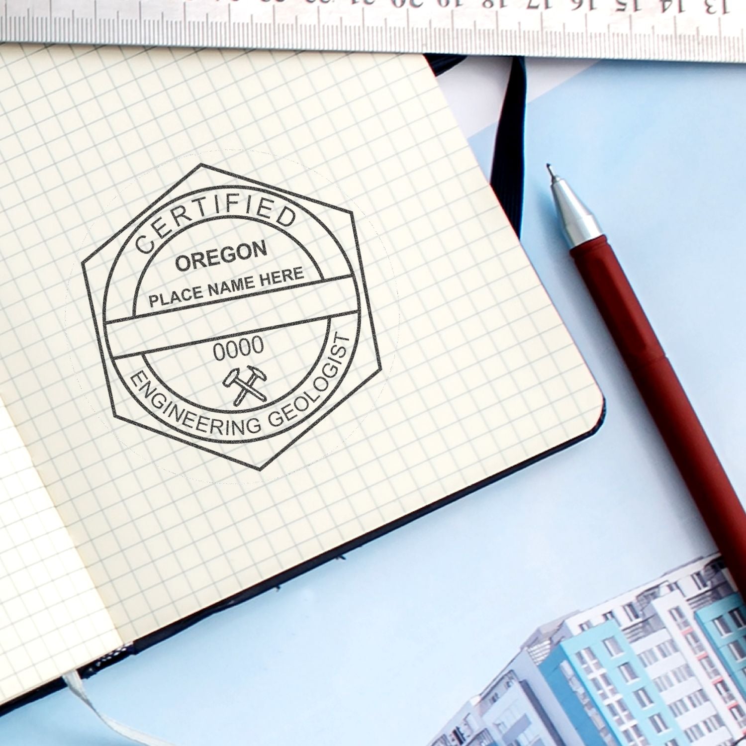 Oregon certified engineering geologist stamp on graph paper notebook with pen and ruler, technical survey and mapping concept.