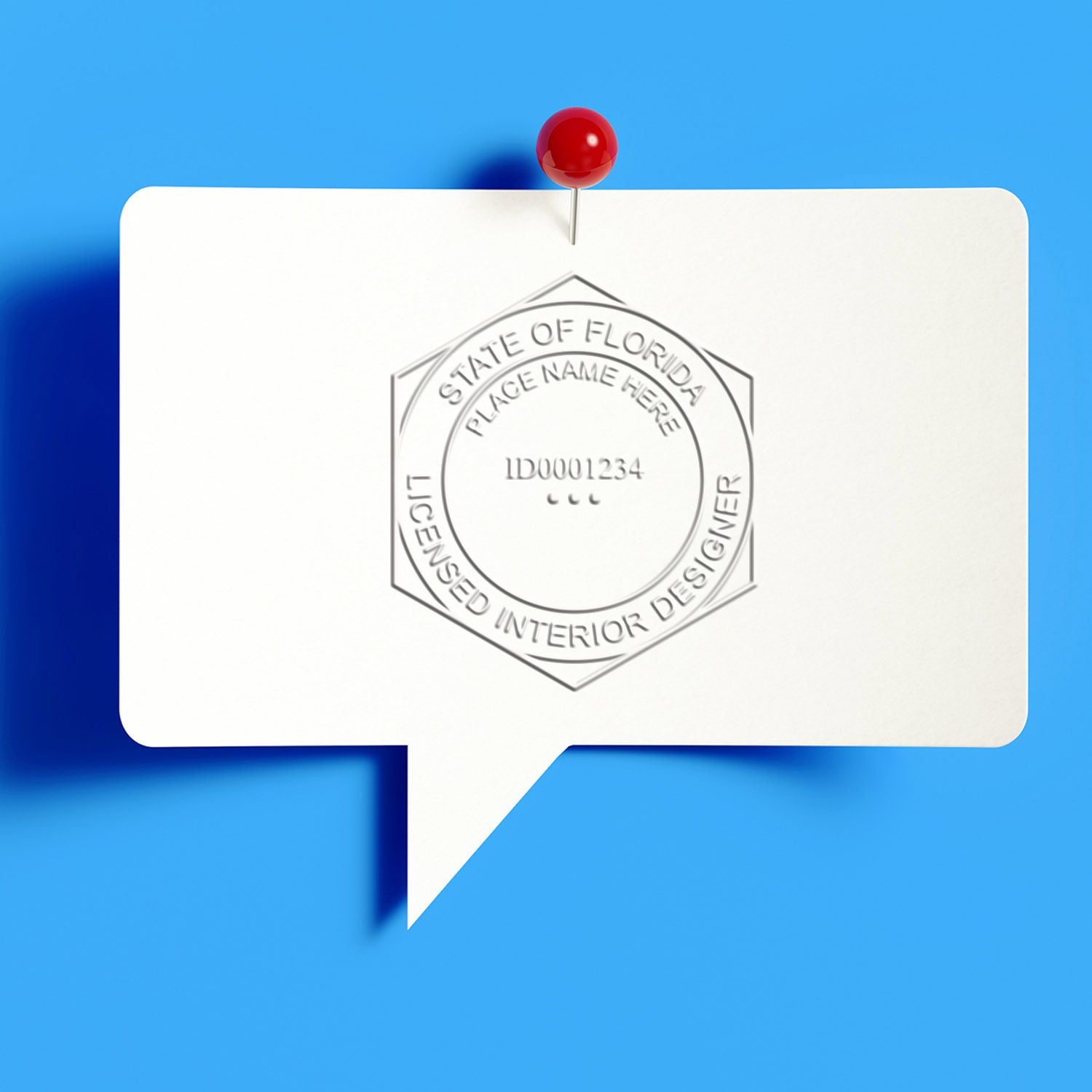 White speech bubble with red pushpin and Florida licensed interior designer stamp on blue background.
