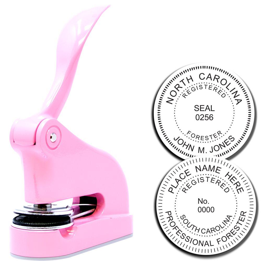 Pink custom embosser seal stamp with North Carolina registered forester seal impressions on white background.