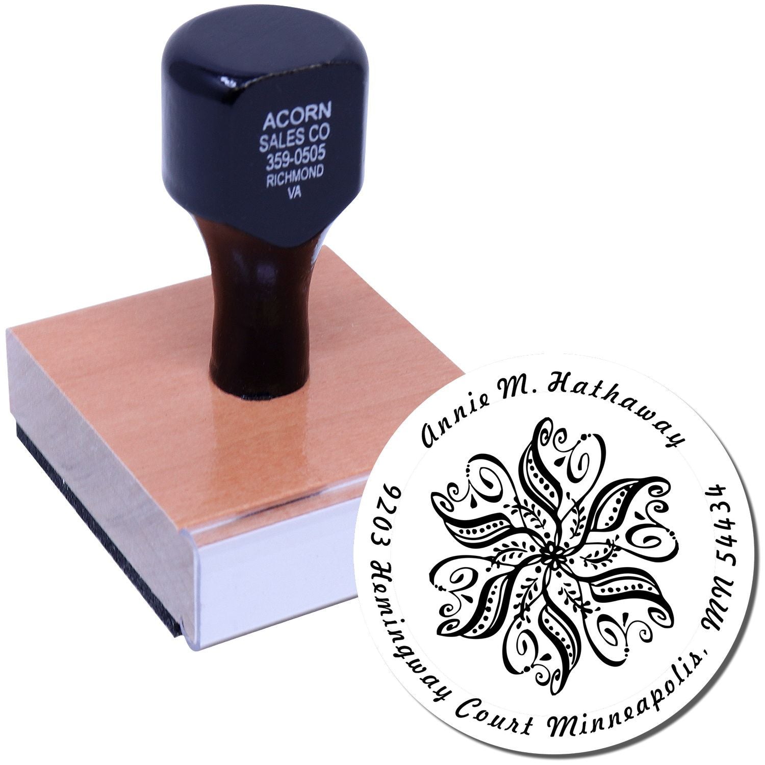 Custom self-inking rubber stamp with personalized return address design and floral logo for business mailing.