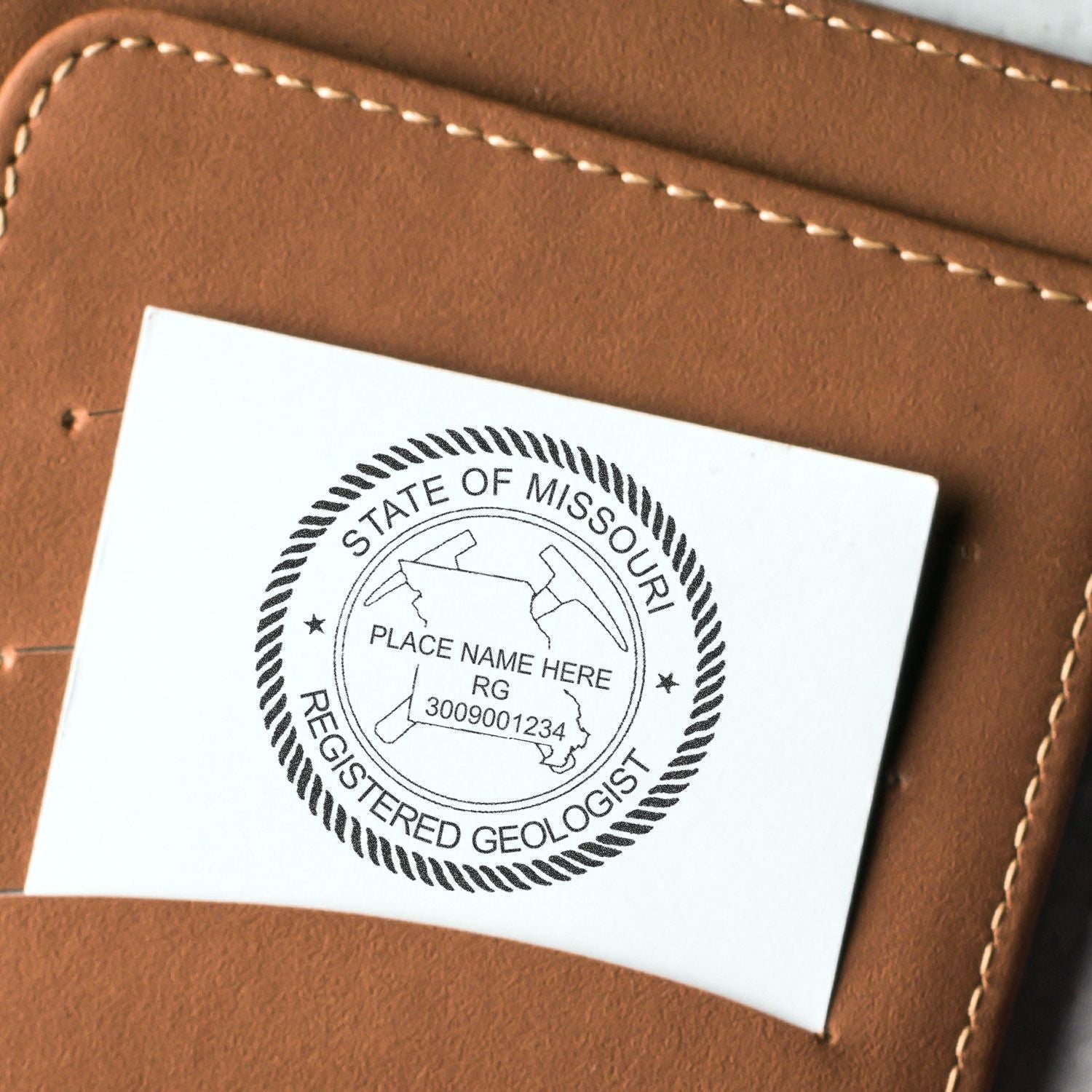 Missouri registered geologist stamp on brown leather notebook cover with custom place name seal