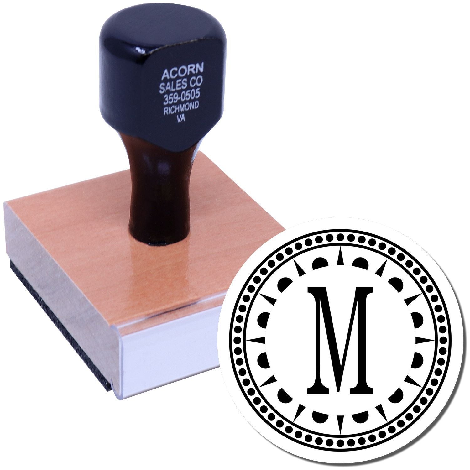 Custom monogram rubber stamp with wooden handle and letter M design for personalized stationery and business branding.