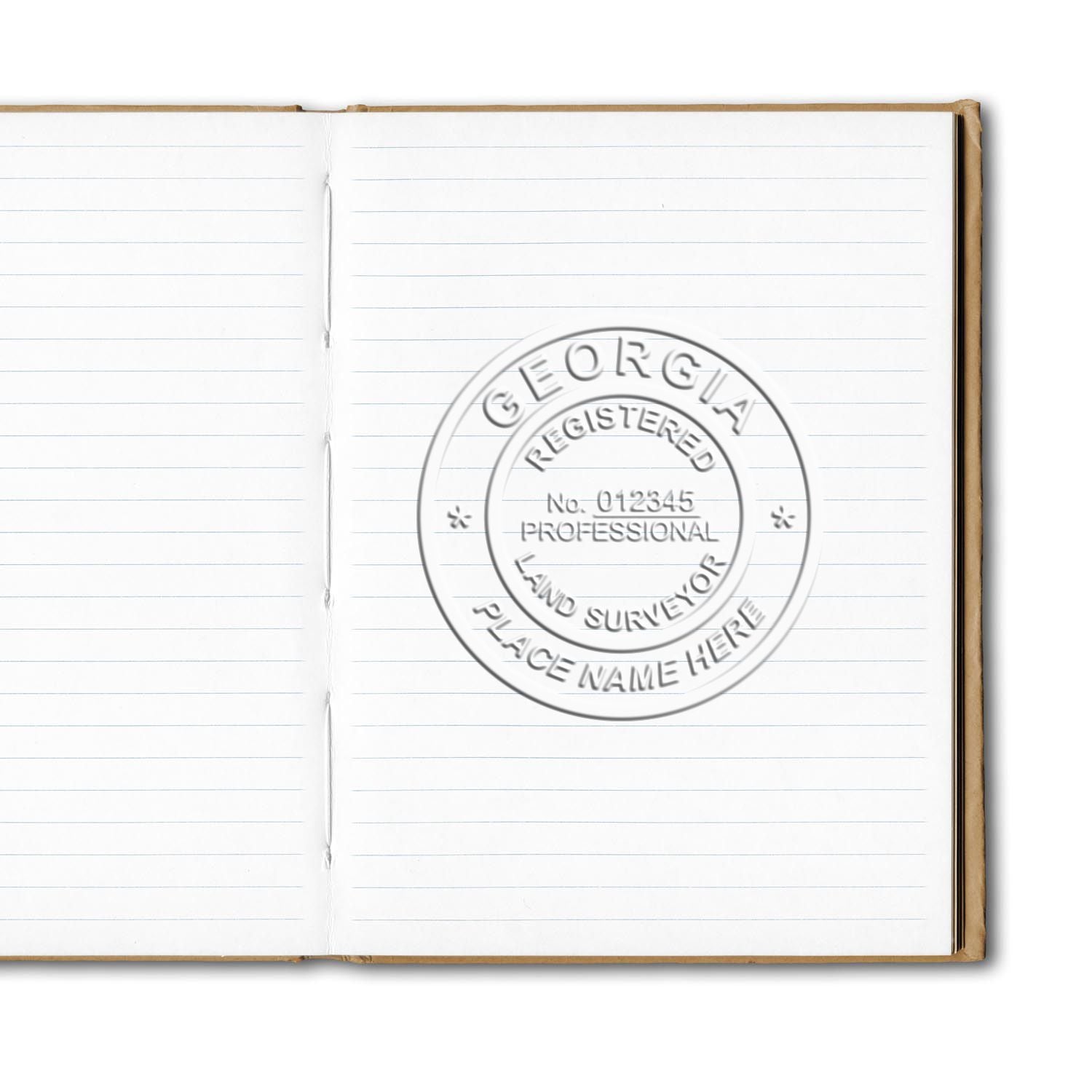 Open lined notebook with Georgia registered professional land surveyor stamp on blank page.