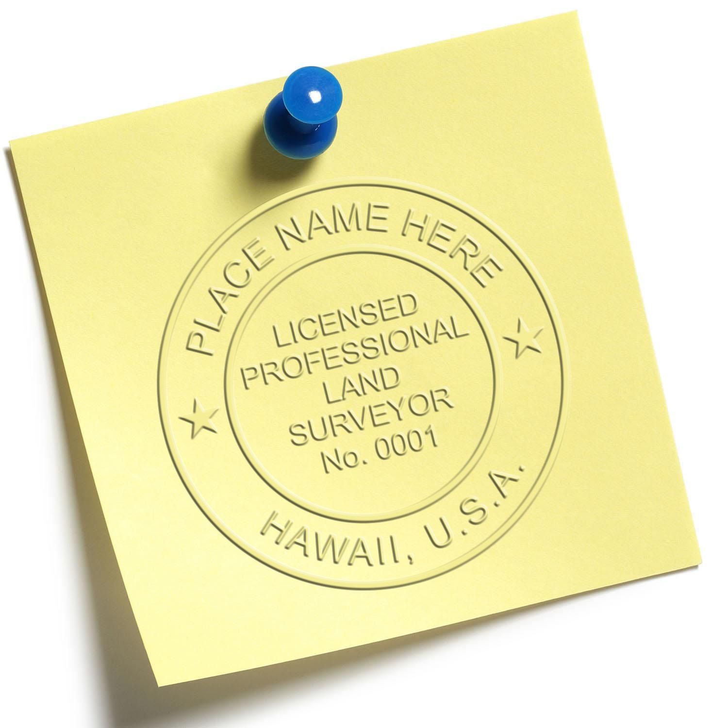 Yellow sticky note pinned with blue pushpin showing embossed Licensed Professional Land Surveyor seal, Hawaii, USA.