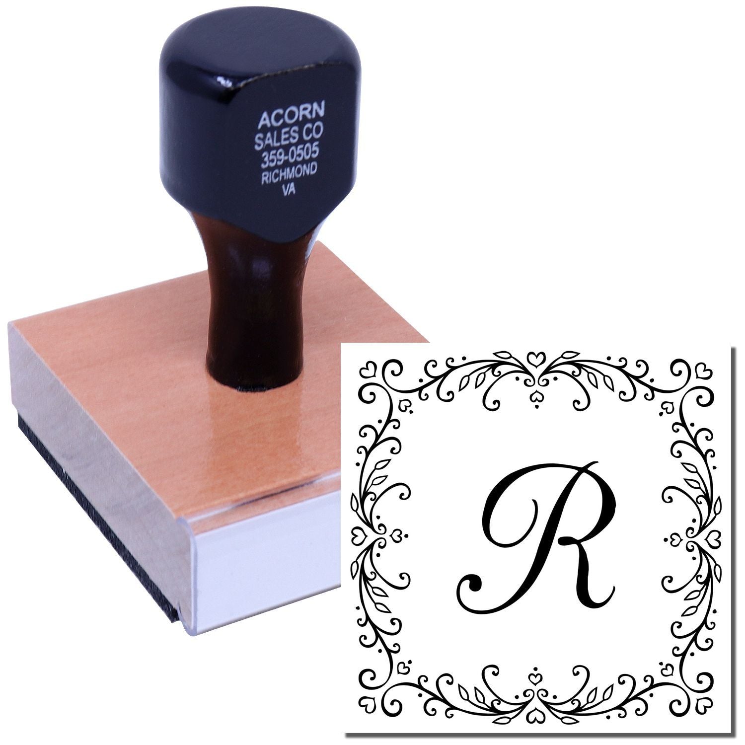 Custom self-inking rubber stamp with ornate floral monogram letter R design for personalized stationery and branding.