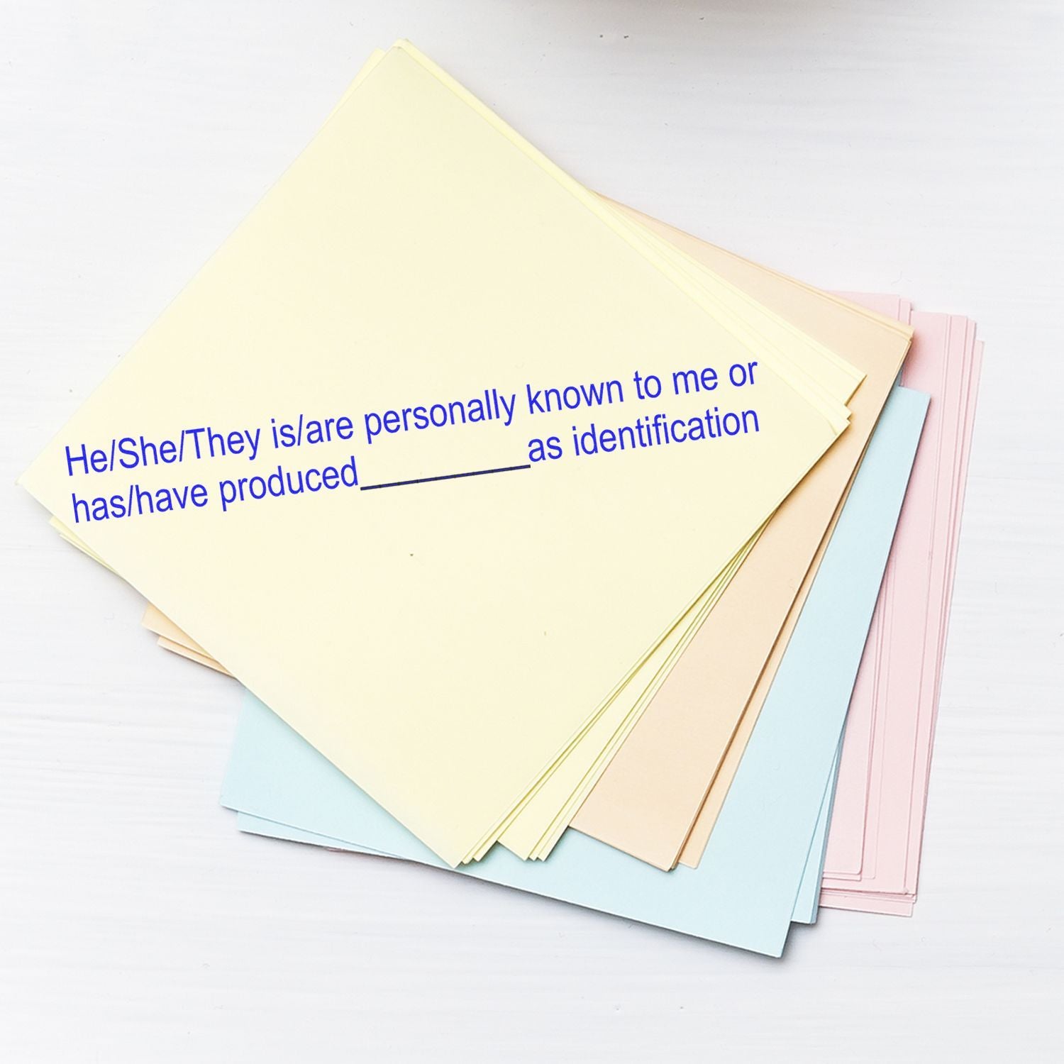 Stack of pastel legal identification forms with printed affidavit text on a white background.